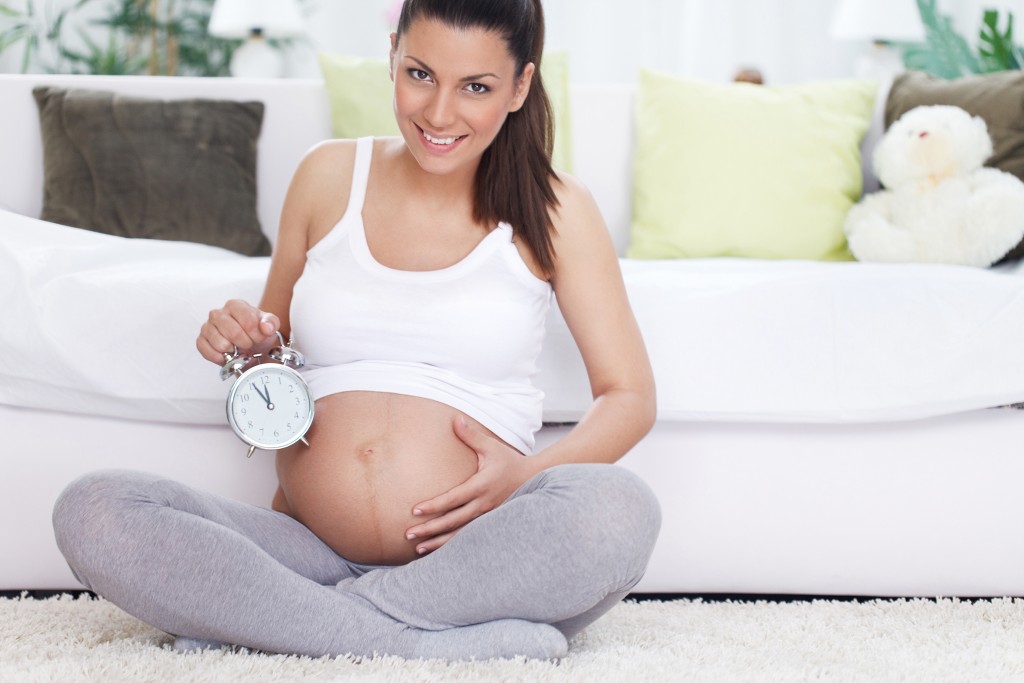 Cheerful young pregnancy expecting baby
